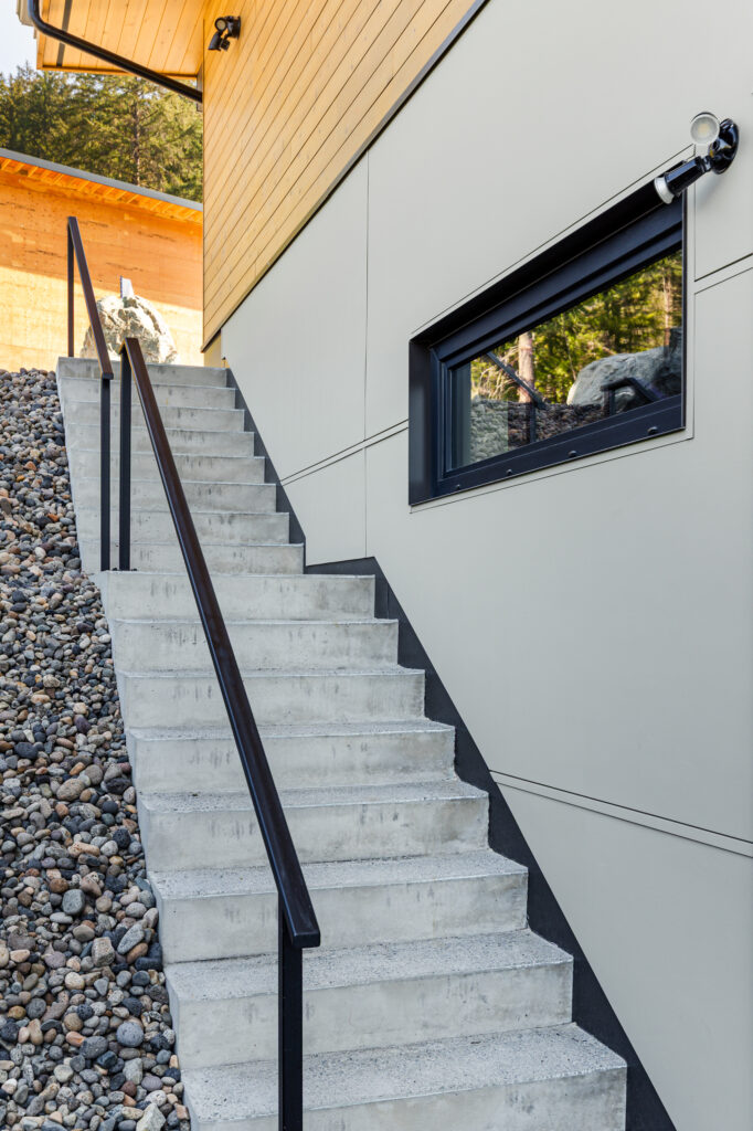 Exterior staircase at Merlot Peak Custom Home in Pemberton by Dorgelo by Design