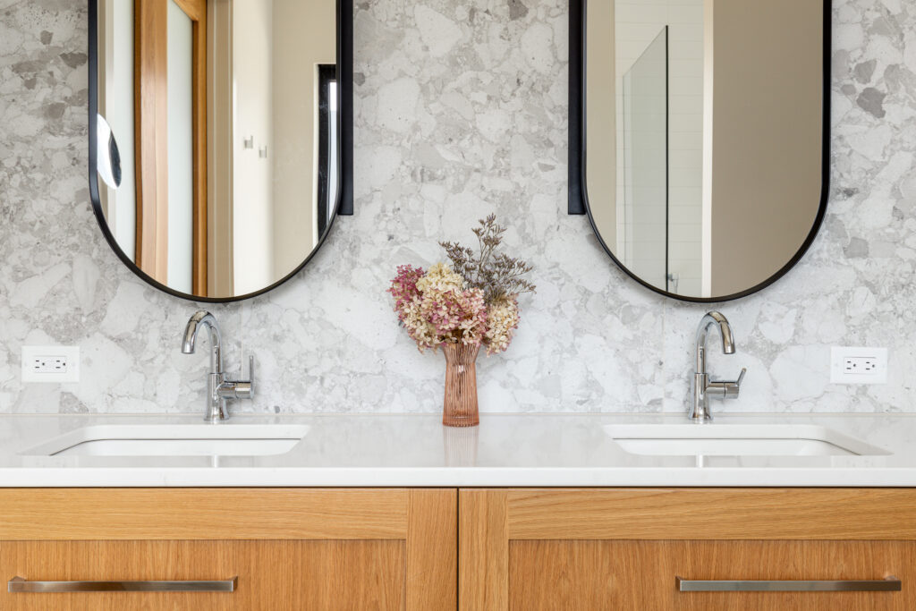 Double sink vanity with round mirrors at Merlot Peak ensuite