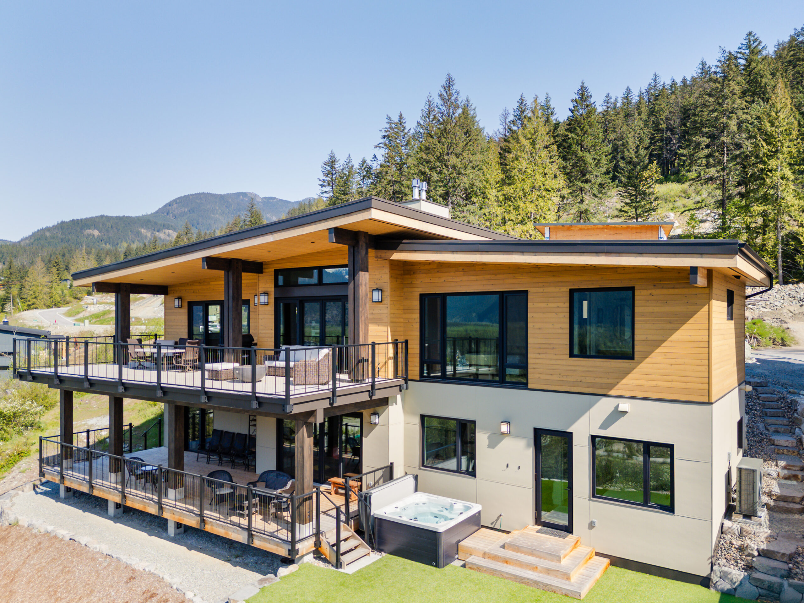 Rear exterior and patio of Merlot Peak Custom Home in Pemberton