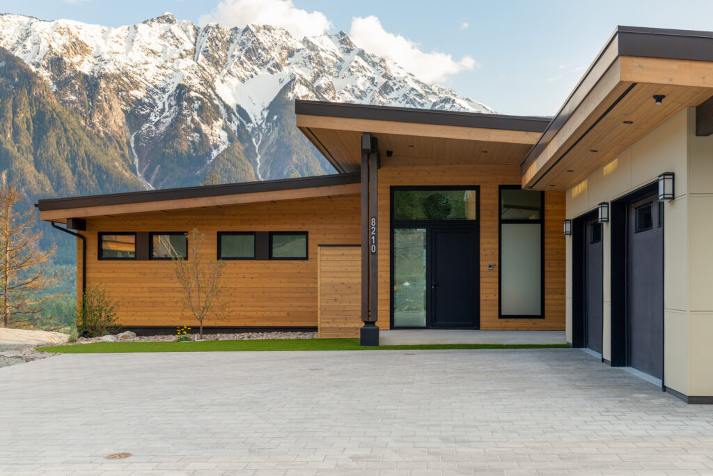 Side angle of Merlot Peak custom home with landscape