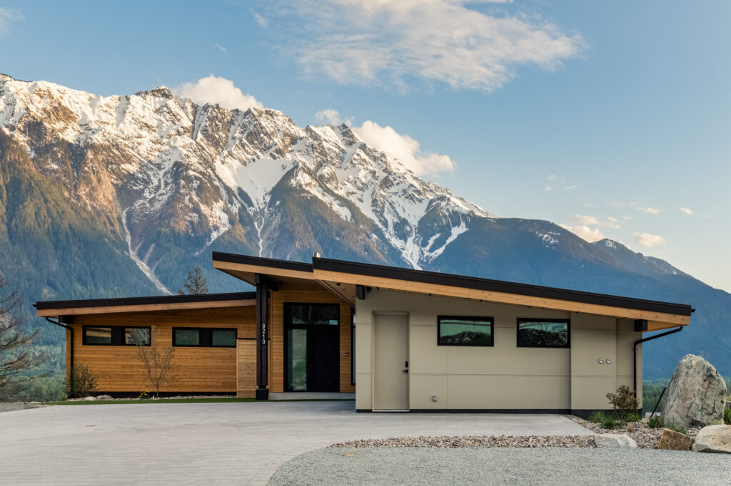 Exterior view of Merlot Peak in Pemberton with snow-capped mountains