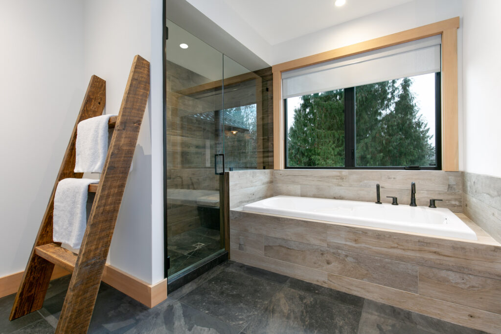 Modern bathroom with Delta Trinsic fixtures and barnboard vanity detail