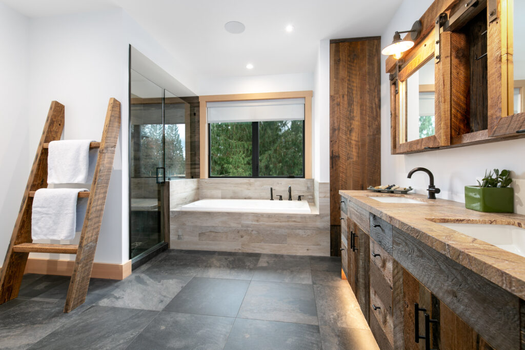 Walk-in shower with full-height porcelain tile and frameless glass