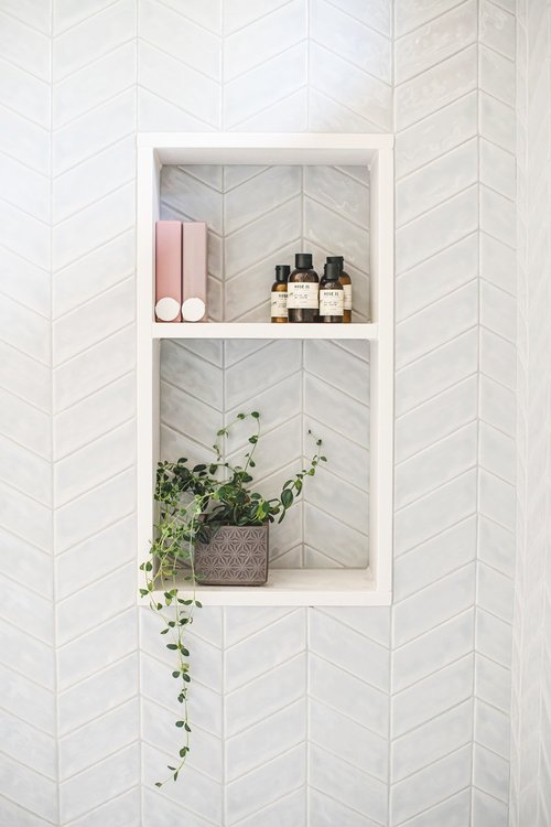 Built-in shower shelf with Cloud Chevron Mosaic tile at Cedar Estates bathroom renovation