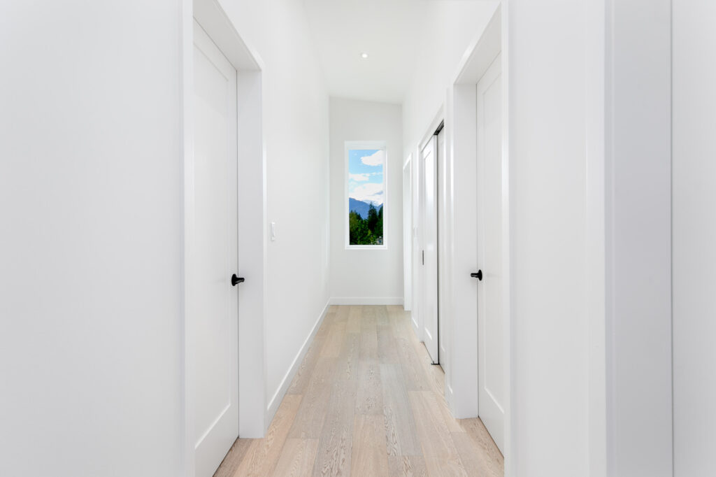 Bright hallway Bright hallway with minimalist design, white walls and warm oak floors