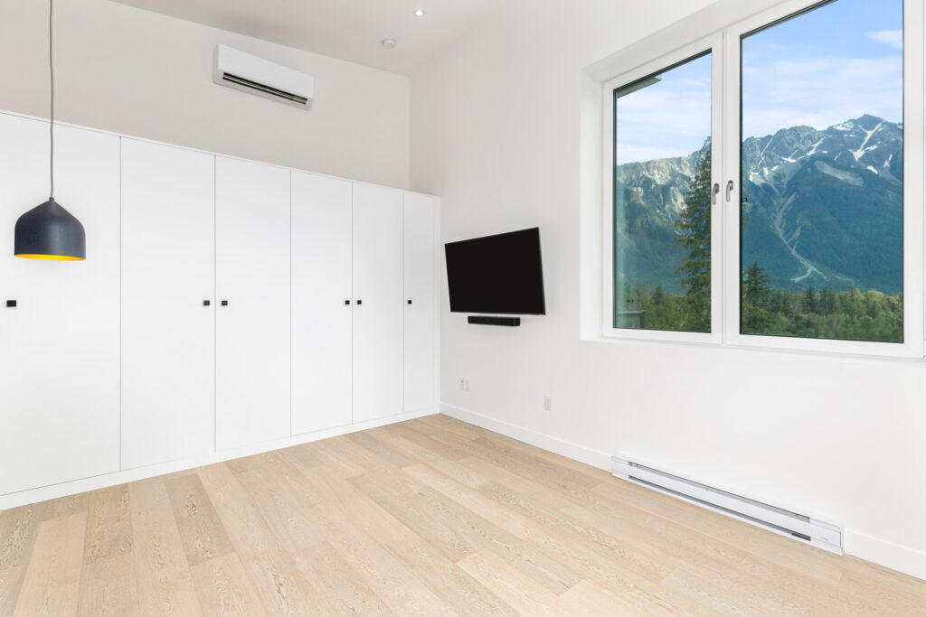 Modern interior Natural wood flooring and floor-to-ceiling windows create an airy, modern interior