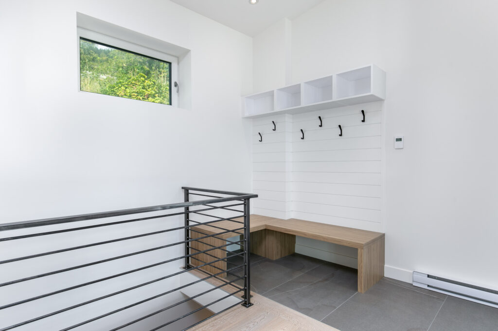 Entryway and wall hooks Functional entryway with custom millwork bench, cubbies, and wall hooks for organized storage