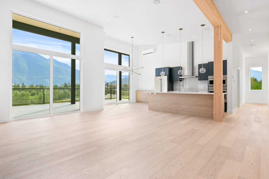 Spacious kitchen Spacious kitchen and dining area with large windows and wood-accented island for natural warmth