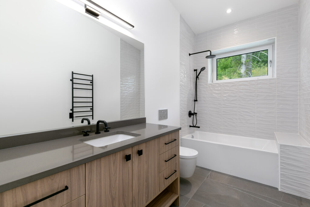 Contemporary bathroom Contemporary bathroom with Egger Walnut cabinetry, concrete grey porcelain countertop and Kontour towel warmer