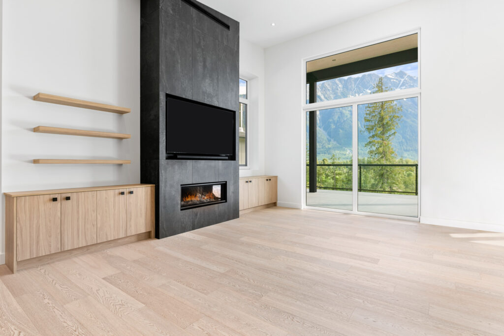 Modern living room fireplace Modern living room fireplace with floor-to-ceiling tile surround and wood cabinetry on both sides