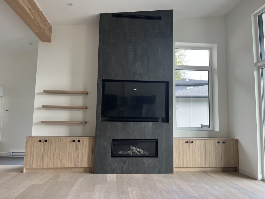 Living room Living room with TV and fireplace feature wall framed by minimalist oak cabinetry