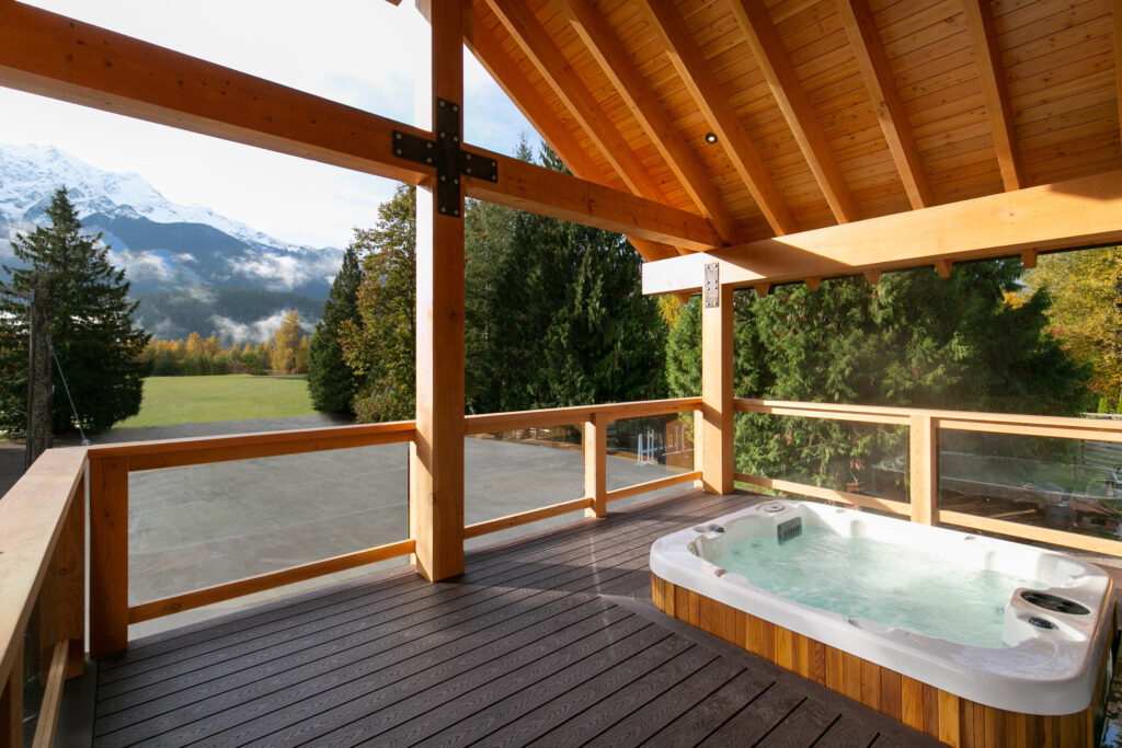 Outdoor hot tub surrounded by cedar accents and metal cladding