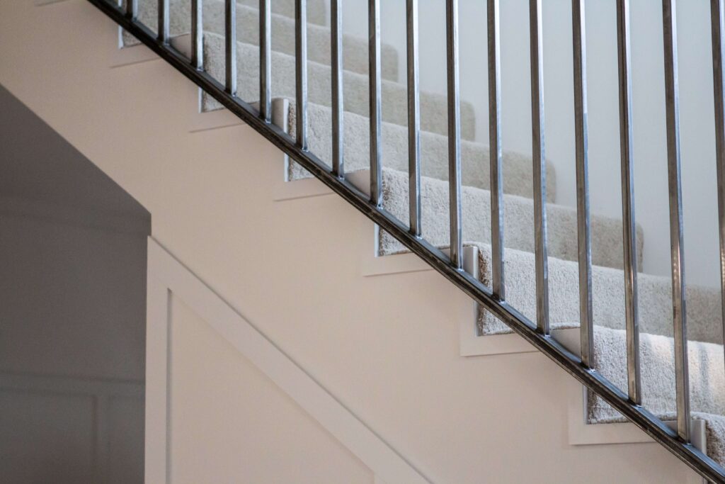 Close-up of metal stair railing with clean modern lines