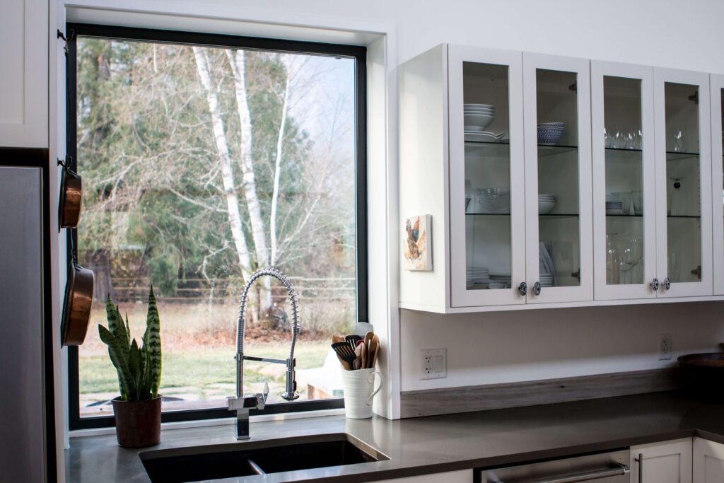 Kitchen with natural light and large window facing trees
