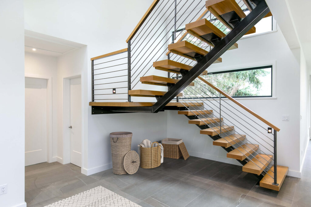 Modern staircase with open risers and wine rack