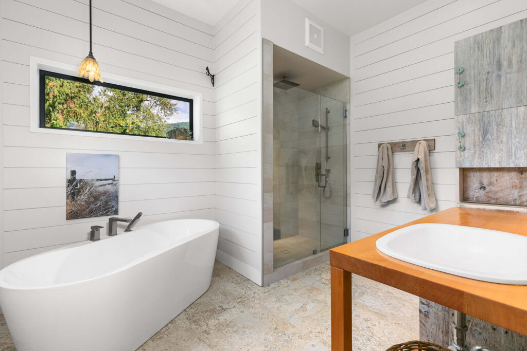 Ensuite shower with floor-to-ceiling tile and minimalist design