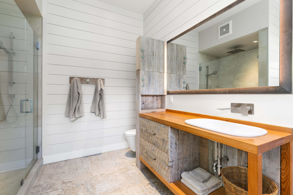 Ensuite bathroom with double vanity and wood accents