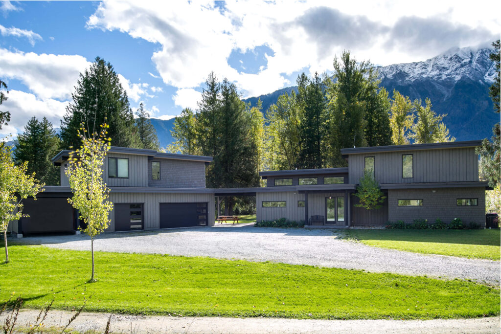 Custom-built home exterior with large windows and cedar siding