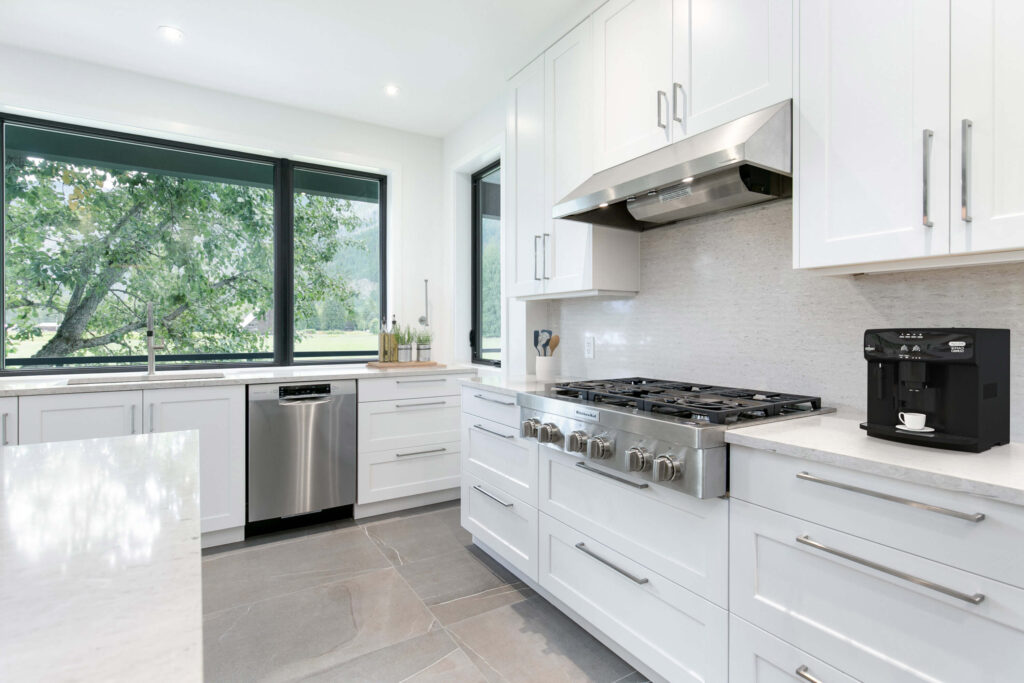 Sleek modern kitchen with window and stove