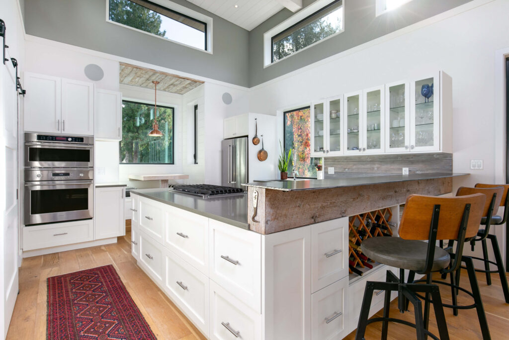 Modern kitchen with white cabinetry and central island