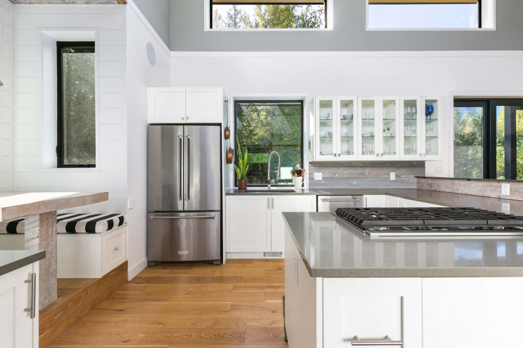Bright white kitchen with stainless steel appliances