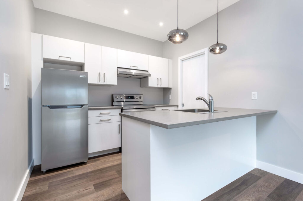Open kitchen Open kitchen and living space with center island and bold blue accent wall
