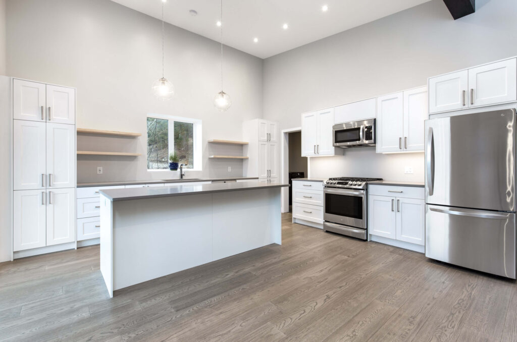 Open kitchen Open kitchen and living space with center island and bold blue accent wall